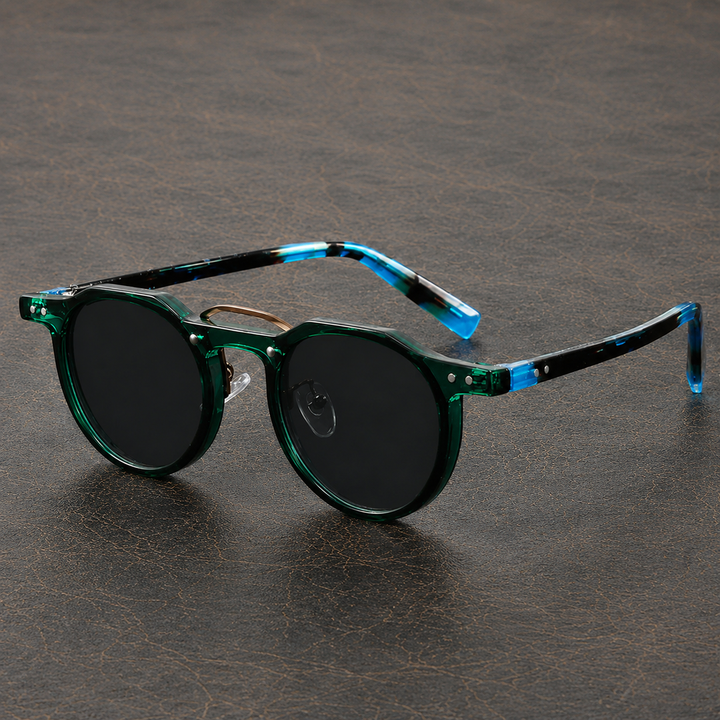 Okrągłe okulary przeciwsłoneczne unisex z ciemnymi szkłami. Modne, komfortowe, na lato.
