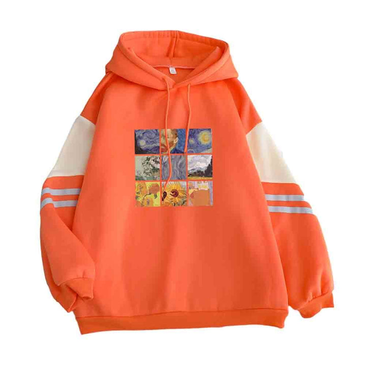 Artystyczna damska bluza oversize z kapturem. Wygodna i modna propozycja z kolorowymi paskami.