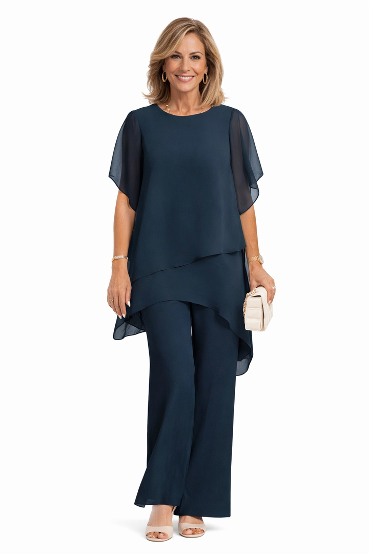 Elegancki komplet damski z szerokimi spodniami i bluzką. Dwuczęściowy zestaw idealny do stylu casual lub smart casual.