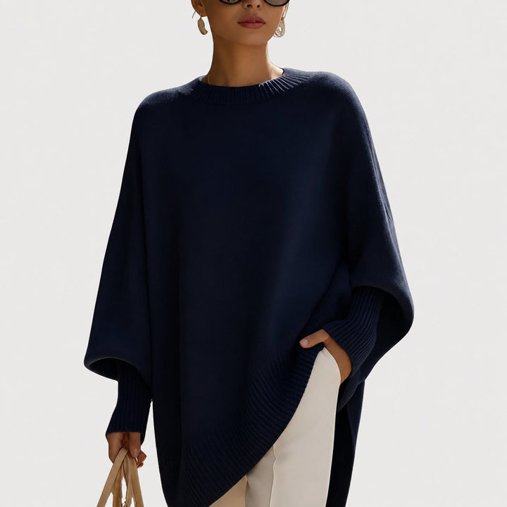 Czarny damski sweter oversize. Modny, komfortowy pulower na jesień i zimę, idealny do casualowych i eleganckich stylizacji.