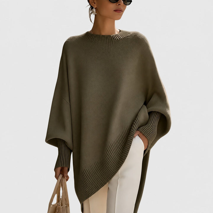 Modny sweter damski oversize, doskonały do casualowych stylizacji. Komfortowy pulower z długim rękawem na jesień/zimę.