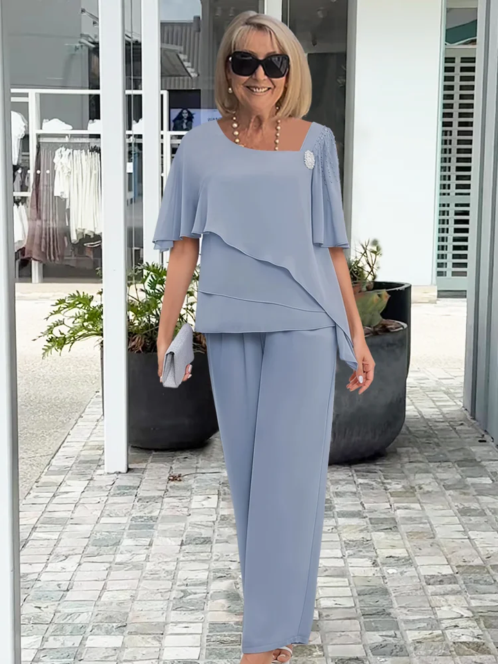 Elegancki szyfonowy komplet damski na wesele lub komunie, zwiewna bluzka i spodnie palazzo.