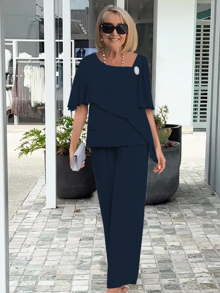 Zwiewny damski komplet szyfonowy, z elegancką bluzką i szerokimi spodniami, moda damska.