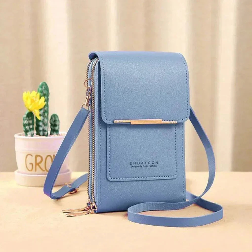 Damska torebka crossbody z przejrzystą kieszenią na smartfon, zapewnia wygodę, styl i bezpieczeństwo.