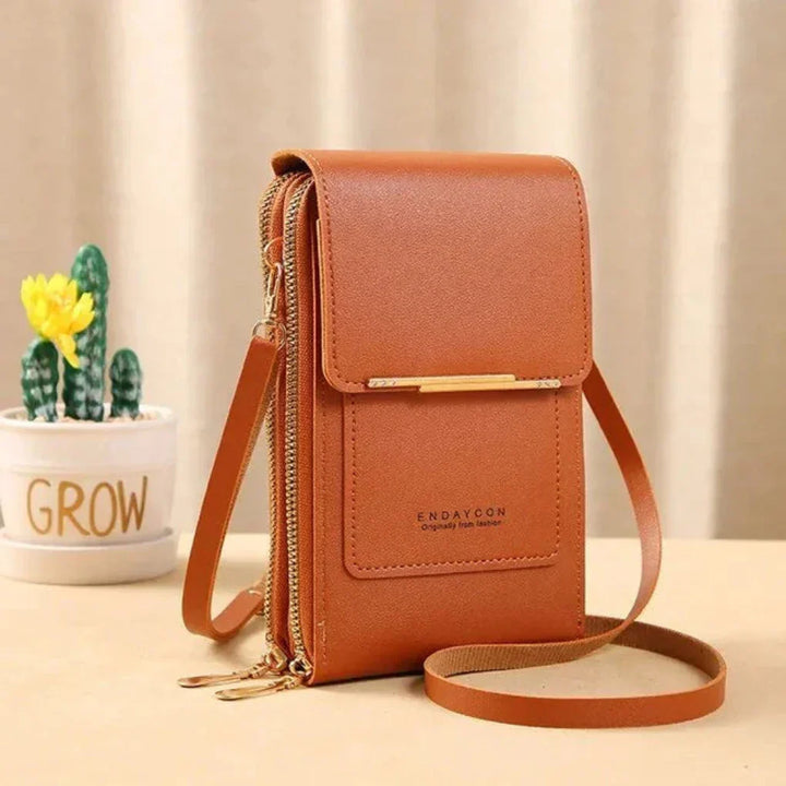 Idealny prezent: damska torba crossbody z innowacyjną, przezroczystą kieszenią na telefon dotykowy.