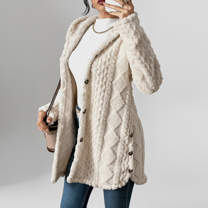 Elegancki sweter damski z kapturem, długi, w luźnym fasonie, doskonały do stylizacji casualowych.
