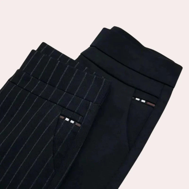 Eleganckie damskie spodnie z wysokim stanem, dopasowany fason ze stretchem dla maksymalnego komfortu i stylu.