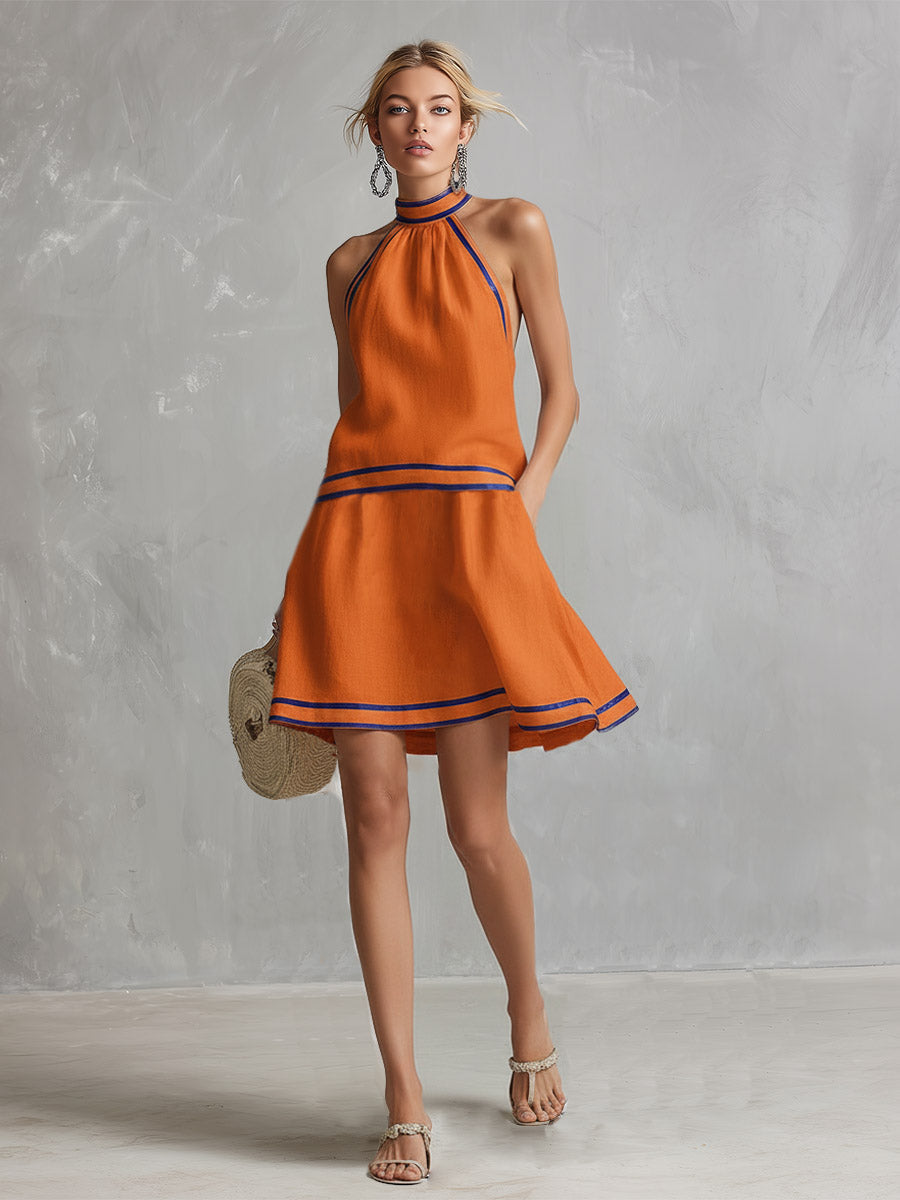 Elegancka casualowa damska mini sukienka wiązana na szyi. Idealna na letnie imprezy, wieczory i wyjścia.