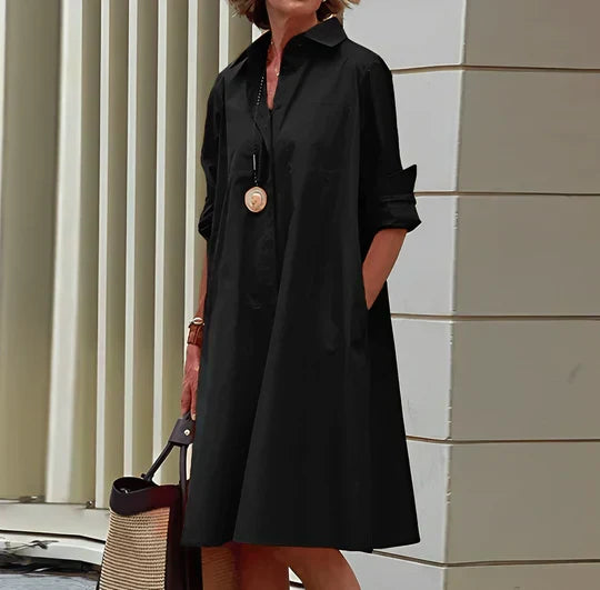 Wiosenna/letnia damska sukienka koszulowa Faustine. Luźny fason z guzikami, idealna na casualowe wyjścia.