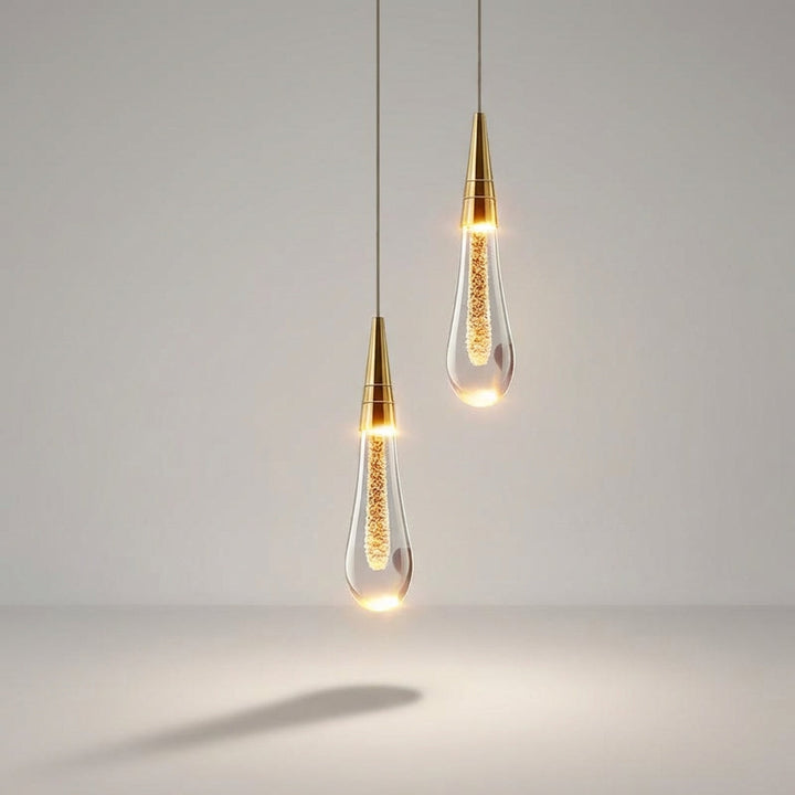 Elegancka lampa wisząca szklana typu kropla. Nowoczesne oświetlenie dekoracyjne do jadalni lub salonu.