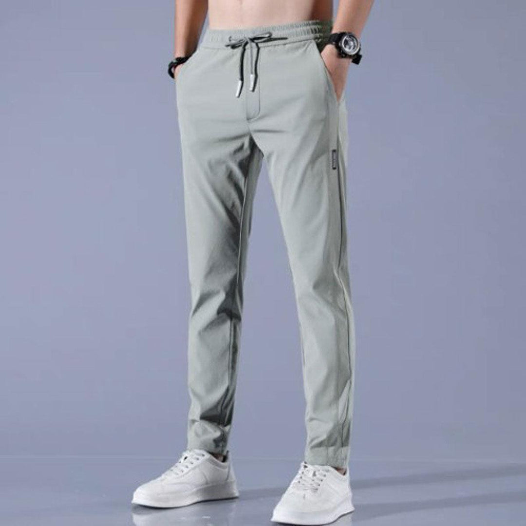 Męskie spodnie sportowe slim fit z elastycznego materiału, szybkoschnące, doskonałe na wiosnę i jesień.