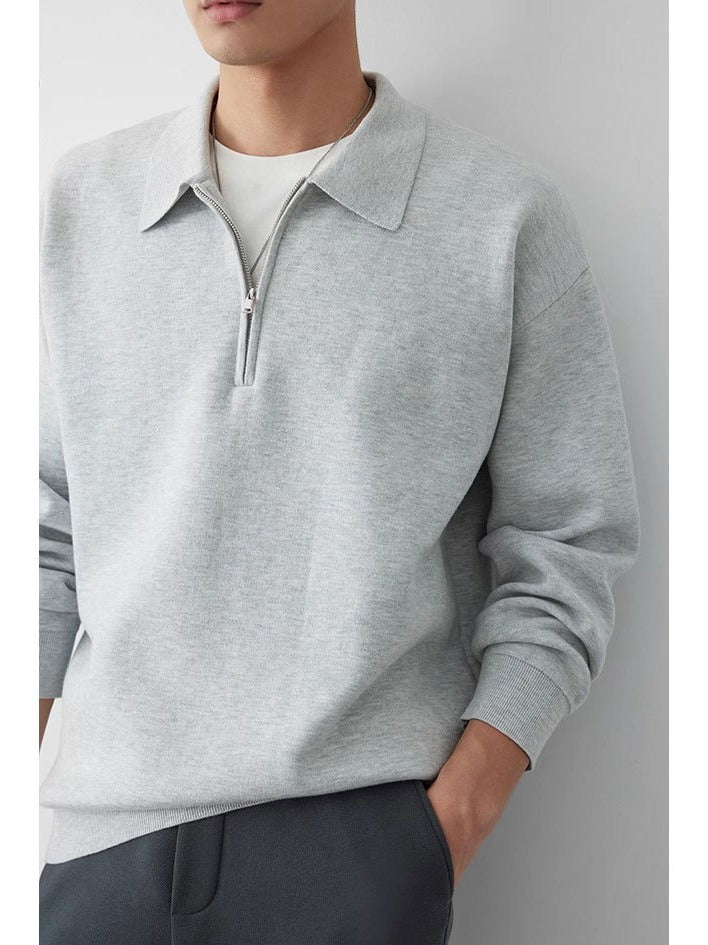 Komfortowa bluza polo unisex z kołnierzykiem. Luźny krój i bawełniany materiał na swobodny styl casual.
