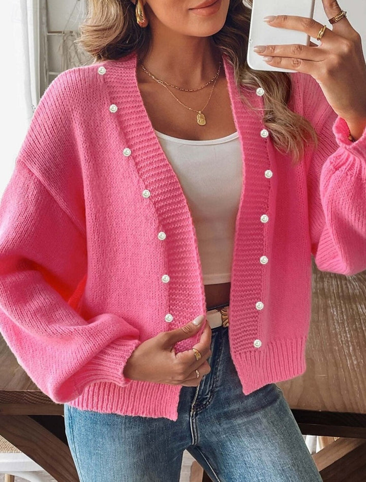 Damski kardigan z perłowymi guzikami. Sweter oversize z bufiastymi rękawami, idealny do codziennych stylizacji.