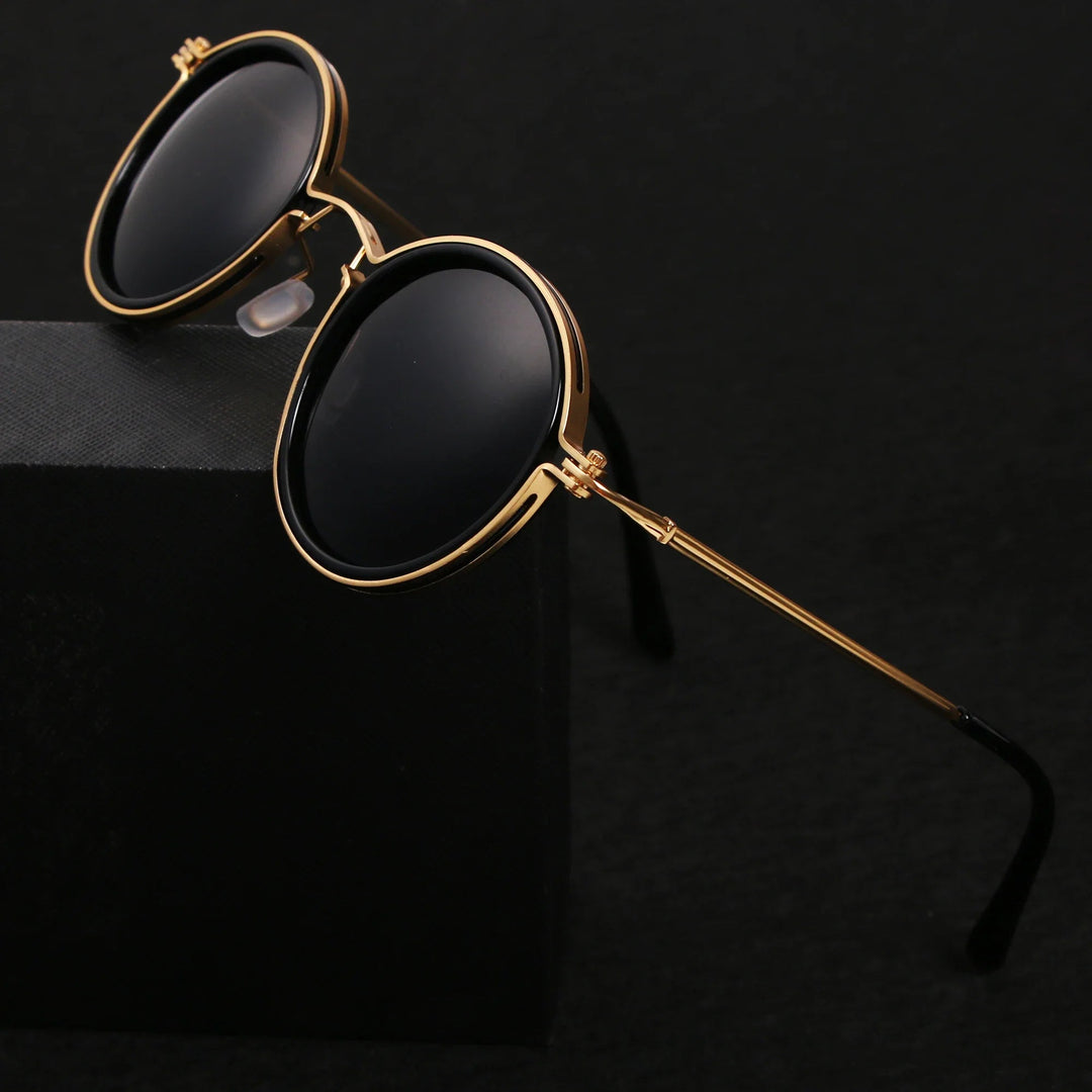 Eleganckie, okrągłe okulary przeciwsłoneczne unisex z ciemnymi soczewkami. Modne i praktyczne na słońce.