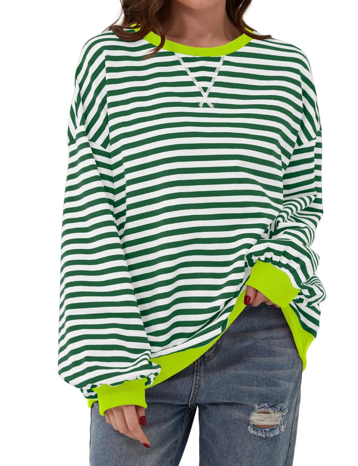 Modna damska bluza w paski, oversize, okrągły dekolt. Wygodna, z długim rękawem, na co dzień.