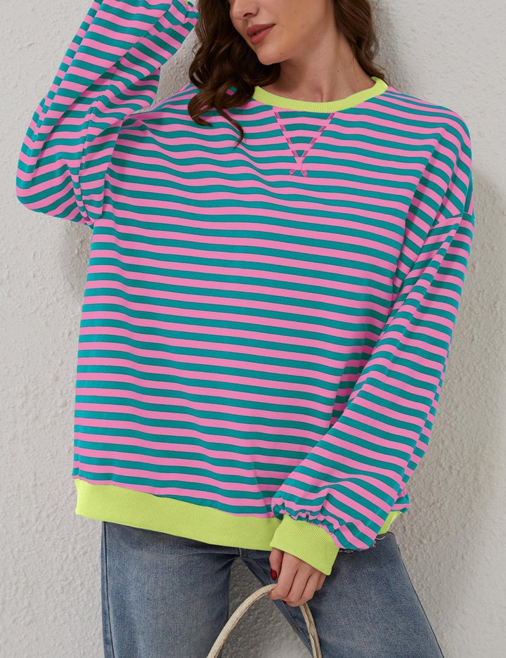 Wygodna bluza damska oversize w paski, swobodny krój, okrągły dekolt. Modna na jesień i wiosnę.