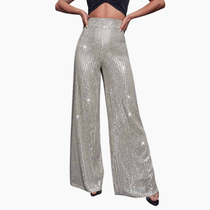 Damskie błyszczące spodnie dzwony z wysokim stanem, idealne na imprezę. Glamour i modny look.