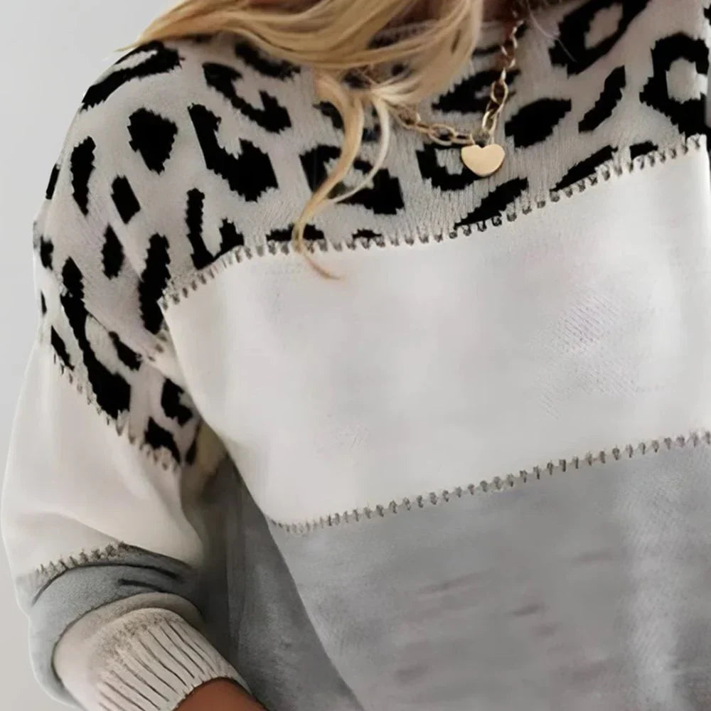 Modny sweter damski w panterkę: wyrazisty, casualowy styl, luźny fason, komfort na co dzień.