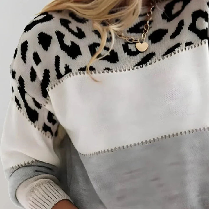 Modny sweter damski w panterkę: wyrazisty, casualowy styl, luźny fason, komfort na co dzień.