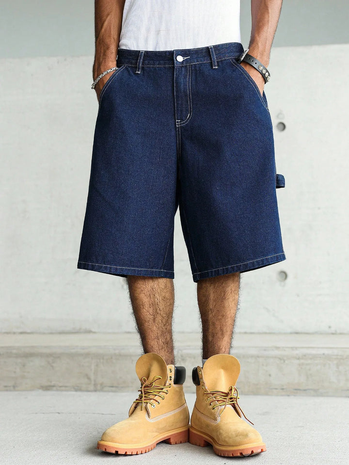 Długie męskie szorty w stylu baggy, granatowe, z luźnym krojem. Must-have na letnie dni i do streetwearu.