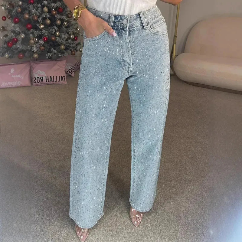 Damskie spodnie wieczorowe: wysoki stan, szerokie nogawki. Cyrkonie dodają blasku. Stwórz elegancki look.