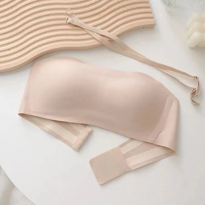 Uniwersalny biustonosz bandeau damski z odpinanymi ramiączkami. Dostępny w bieli, czerni, beżu.