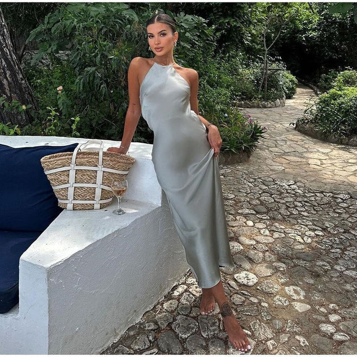 Elegancka sukienka wieczorowa maxi kopertowa z odkrytymi plecami, doskonała na wesele lub galę.