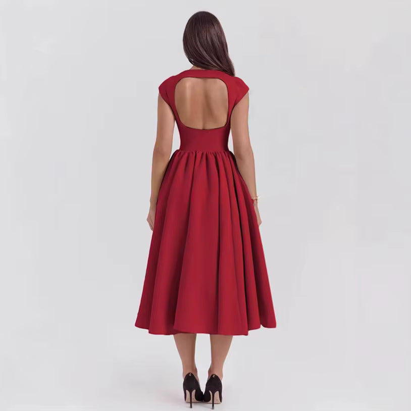 Stylowa sukienka midi damska z krótkim rękawem. Elegancka kreacja na wieczór, klasyczna na dzień.