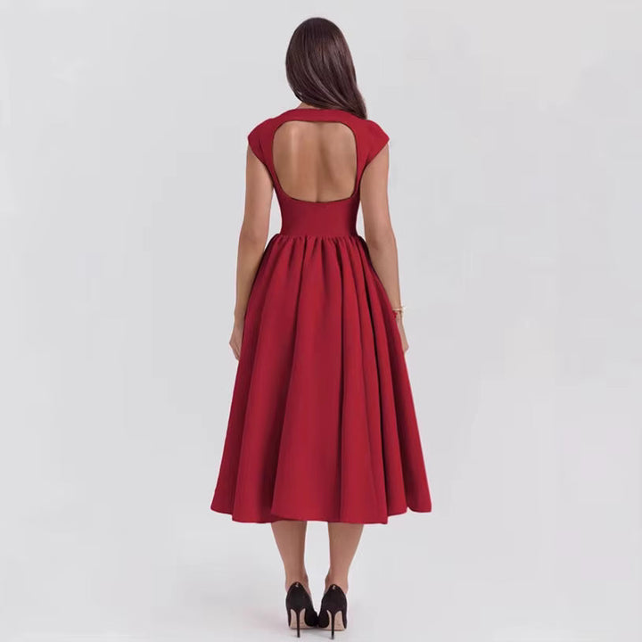 Stylowa sukienka midi damska z krótkim rękawem. Elegancka kreacja na wieczór, klasyczna na dzień.