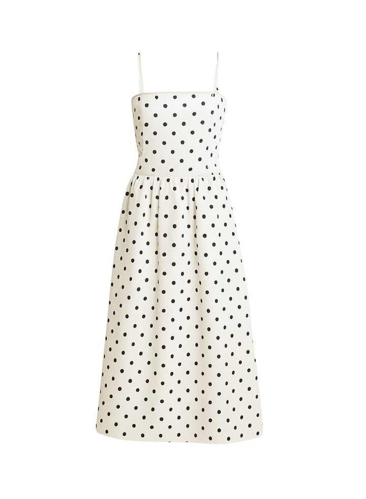 Lekka damska sukienka midi w kropki z ramiączkami. Casualowa elegancja w stylu retro, fason A-linii.