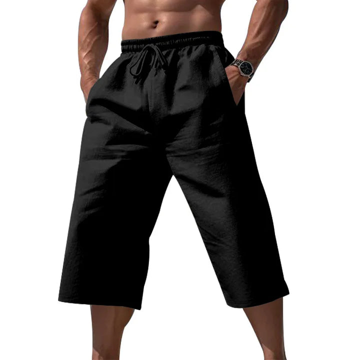 Stylowe męskie szorty do kolan z regulowanym sznurkiem. Modne i wygodne szorty casual na lato.