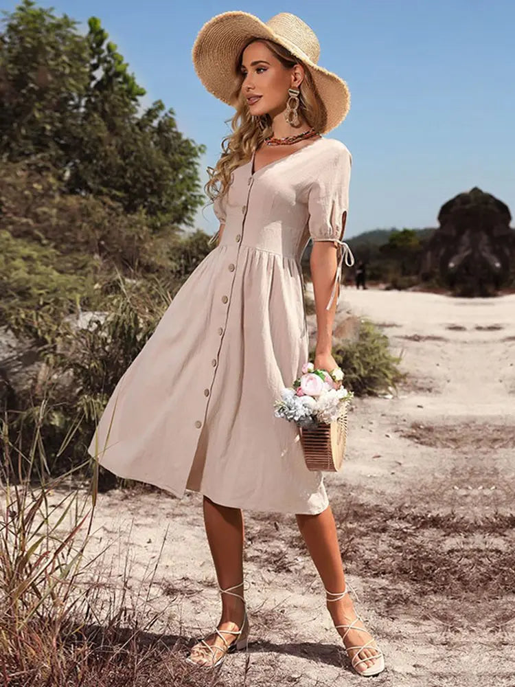 Elegancka sukienka damska casual z bawełny, dekolt V, luźna. Wiosenno-letnia, wygodna do noszenia na co dzień.