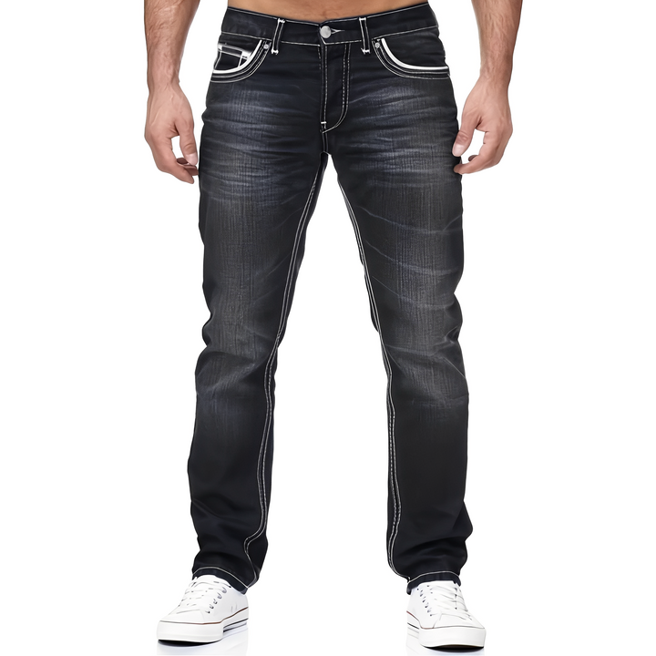 Modne męskie jeansy Andy. Stylowe spodnie denim z efektem postarzenia zapewniające komfort i swobodę ruchu.