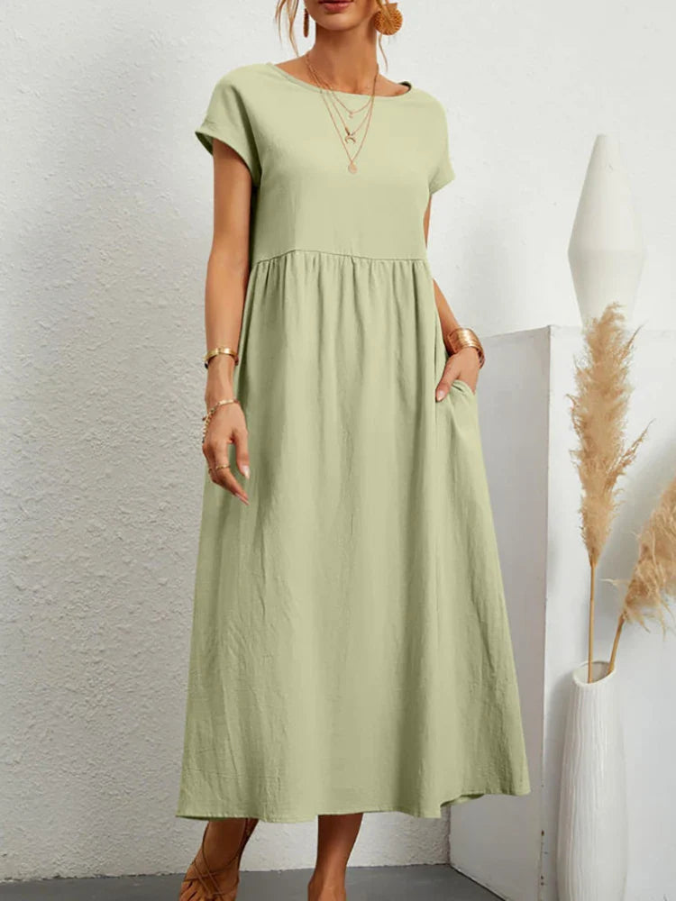 Komfortowa sukienka vintage dla kobiet, wykonana z bawełny, dekolt okrągły, styl casualowy.