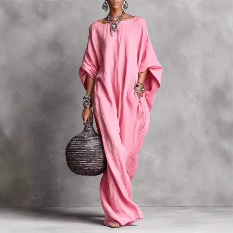 Elegancka sukienka letnia maxi damska. Luźny fason, zwiewny materiał i stylowe nietoperzowe rękawy.