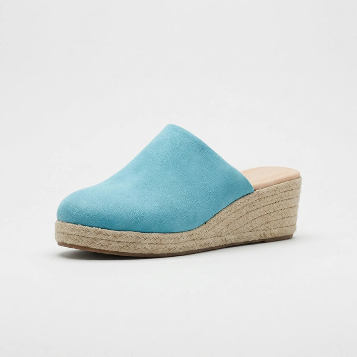 Modne mule damskie na koturnie z okrągłym noskiem. Stylowe wsuwane buty, komfortowe i eleganckie.
