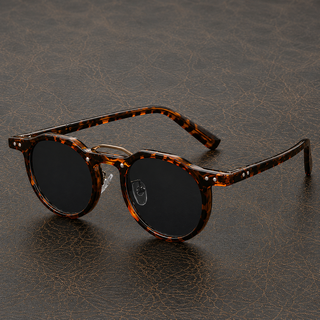 Unisex okulary przeciwsłoneczne okrągłe z ciemnymi szkłami. Ochrona UV i retro design.