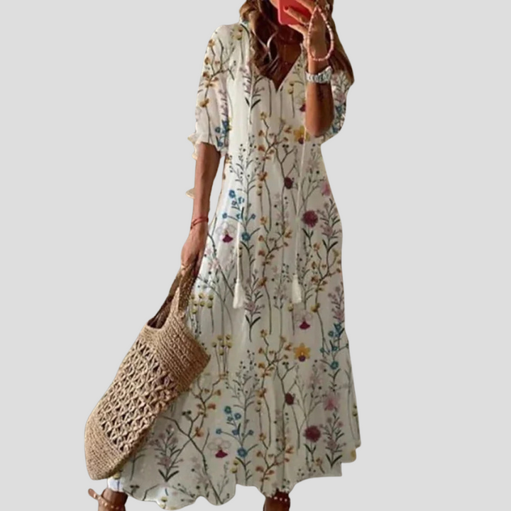 Modna długa sukienka maxi boho dla kobiet, zwiewna i komfortowa, idealna na letnie dni i wakacje.