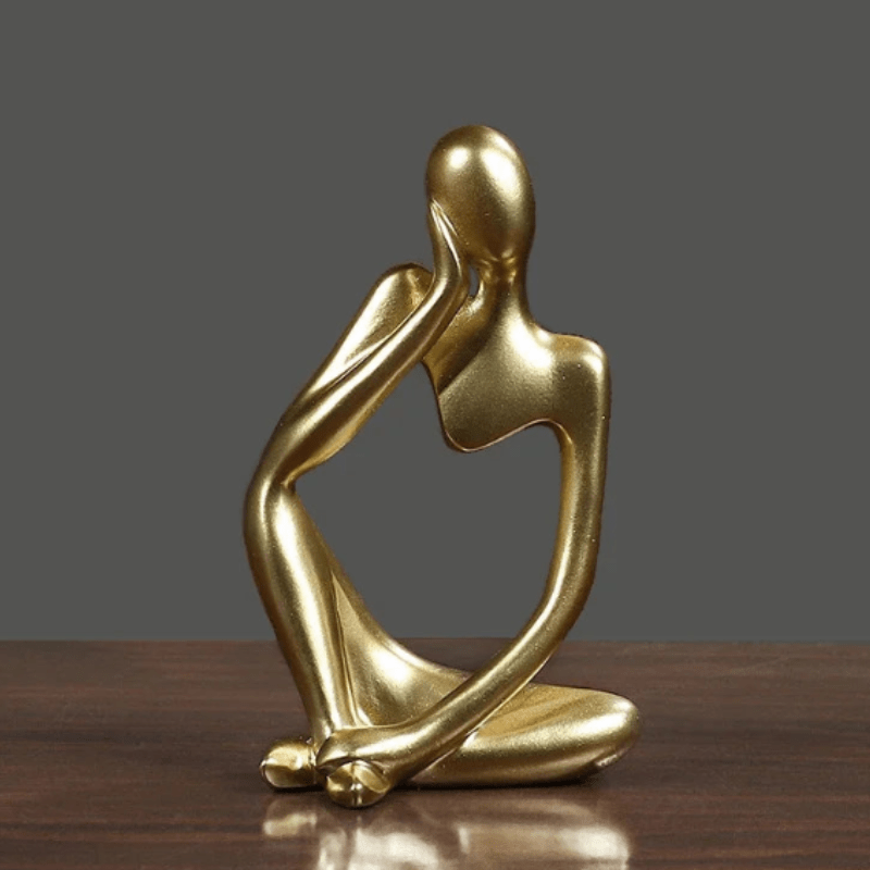 Figurka myśliciela, abstrakcyjna ozdoba do biura, symbol refleksji i kreatywności.