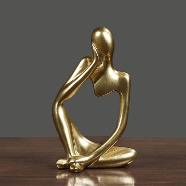 Figurka myśliciela, abstrakcyjna ozdoba do biura, symbol refleksji i kreatywności.