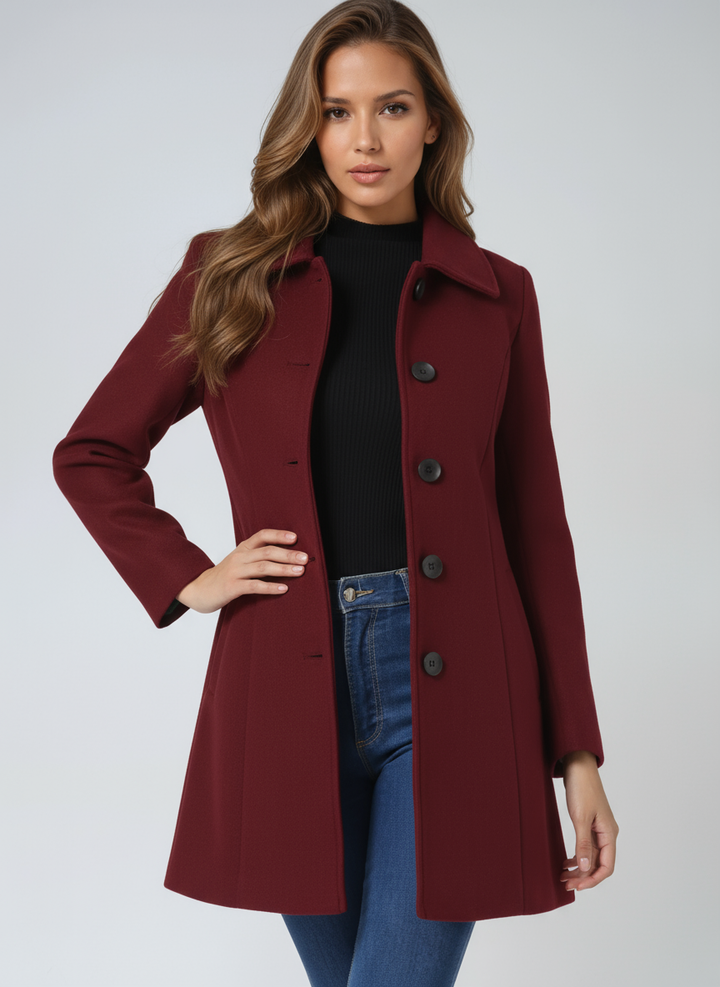 Damski płaszcz midi evasé z ozdobnymi guzikami. Modne i eleganckie okrycie wierzchnie na zimę.