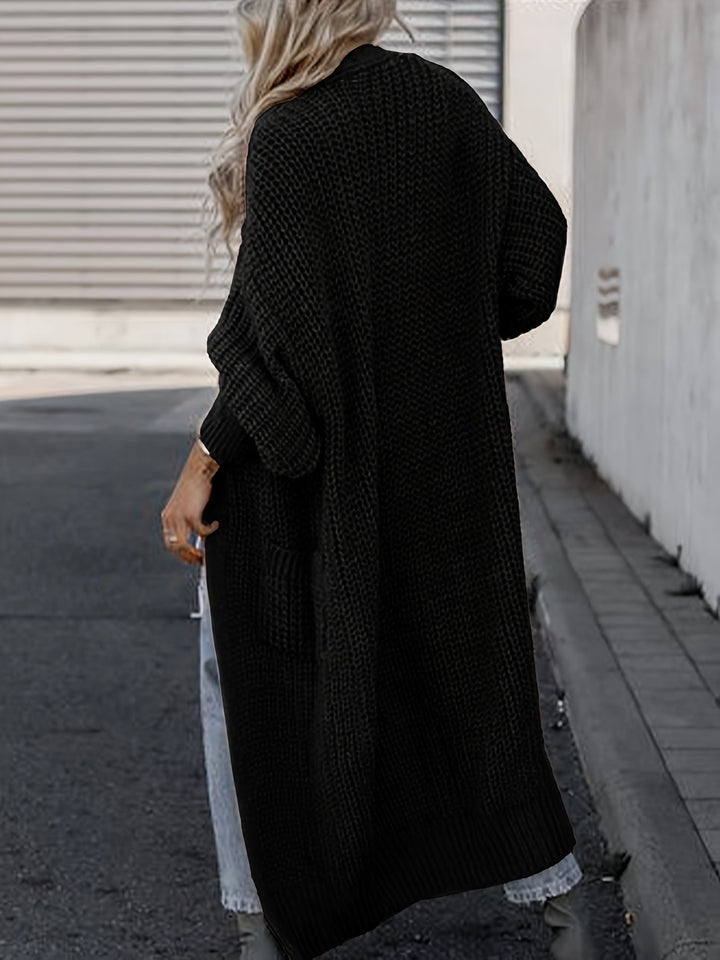 Komfortowy damski kardigan maxi z kieszeniami, miękki materiał, styl casual, idealna narzutka.