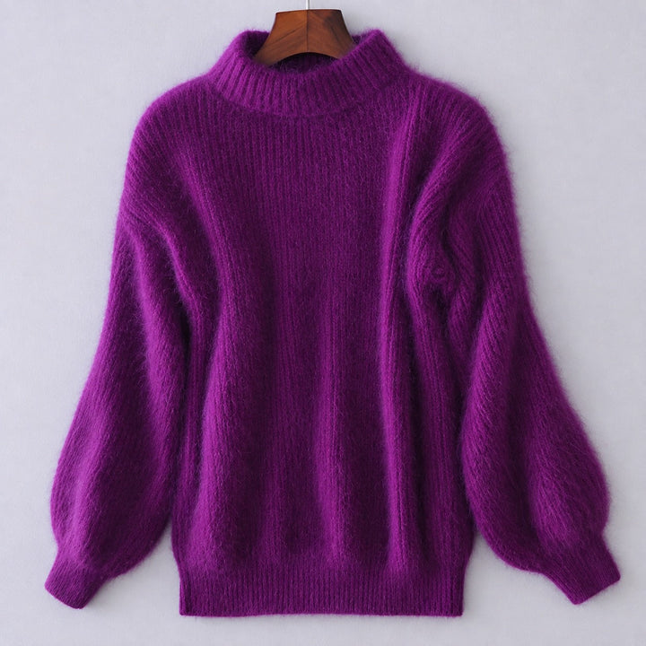 Stylowy damski sweter z golfem, luźny i wygodny, idealny do casualowych i eleganckich stylizacji.