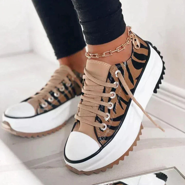 Damskie sneakersy Léonie z innowacyjną amortyzacją, idealne do sportowych i codziennych stylizacji. Wygoda przez cały dzień.