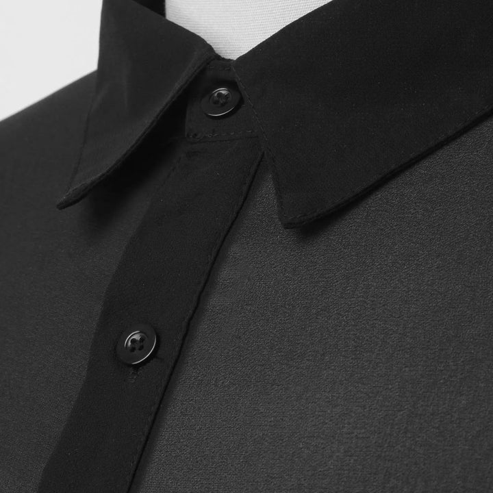 Nowoczesna męska koszula slim fit czarna z długim rękawem. Dopasowany krój podkreślający sylwetkę, komfort.