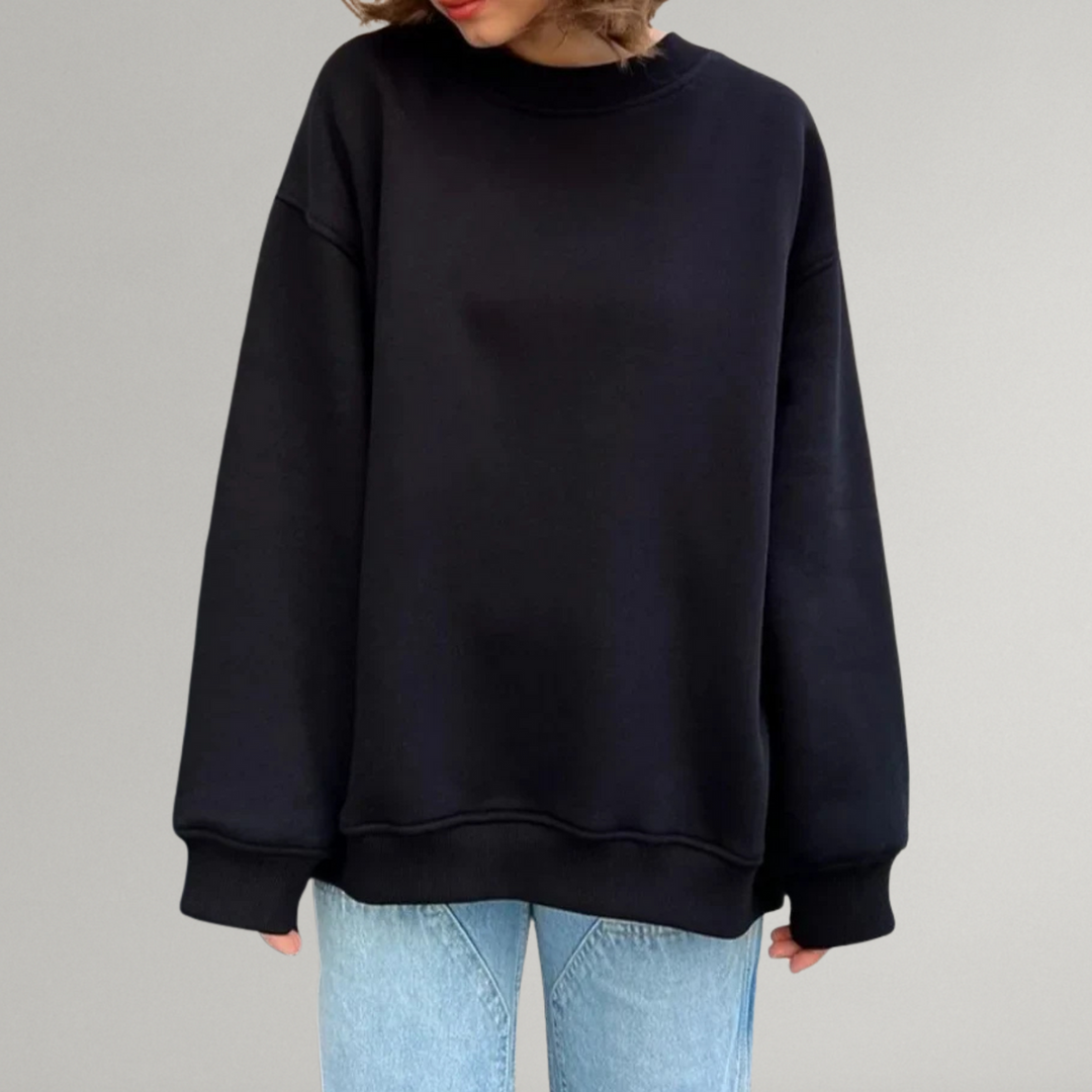 Komfortowa bluza damska oversize z okrągłym dekoltem i długim rękawem. Luźny krój na jesień/zimę.