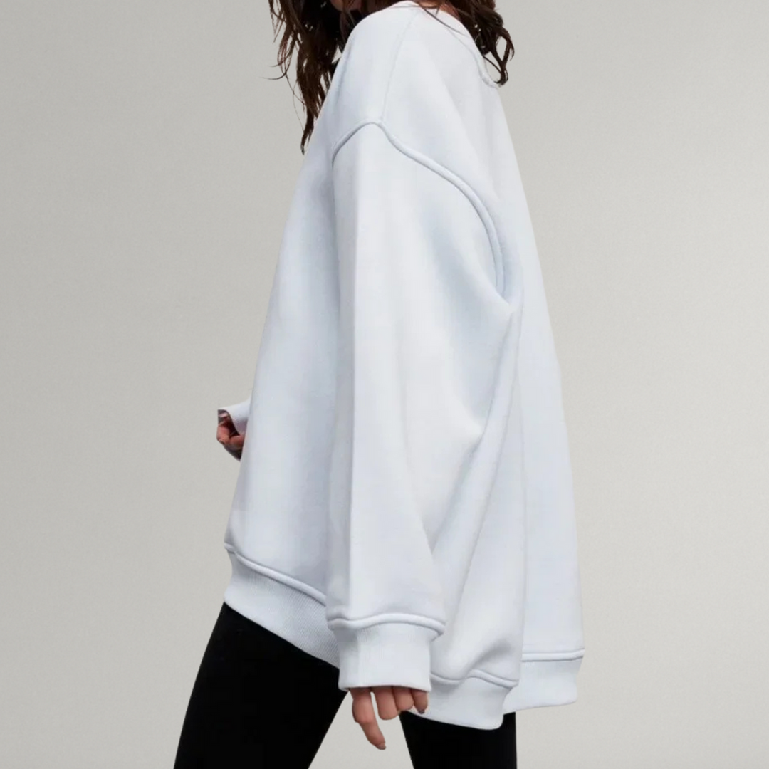 Luźna bluza damska oversize z okrągłym dekoltem. Bez kaptura, długi rękaw. Modna, komfortowa odzież damska.