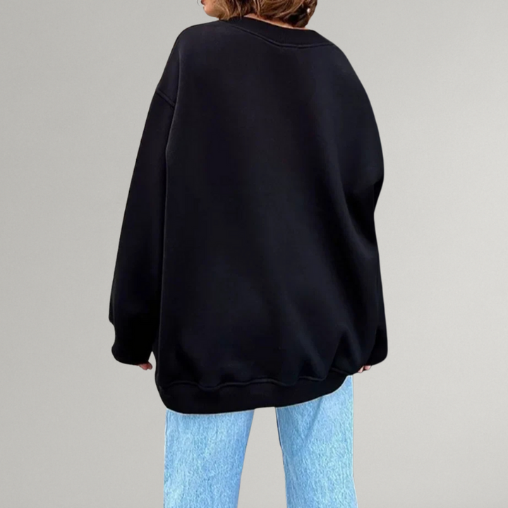 Stylowa bluza damska oversize, okrągły dekolt. Długi rękaw, bez kaptura. Modna, komfortowa odzież casual.