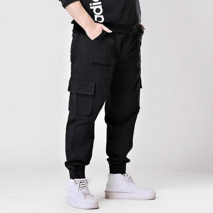 Męskie spodnie bojówki cargo w kolorze zielonym, luźne, z elastycznym pasem, idealne do streetwearu, wygodne.
