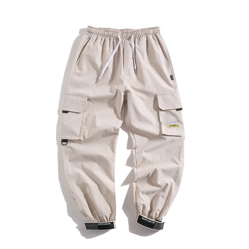 Męskie bojówki cargo z modnymi naszywkami, idealne do streetwearu i casualowych stylizacji.